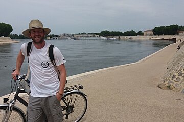 a man and his bike on a river path