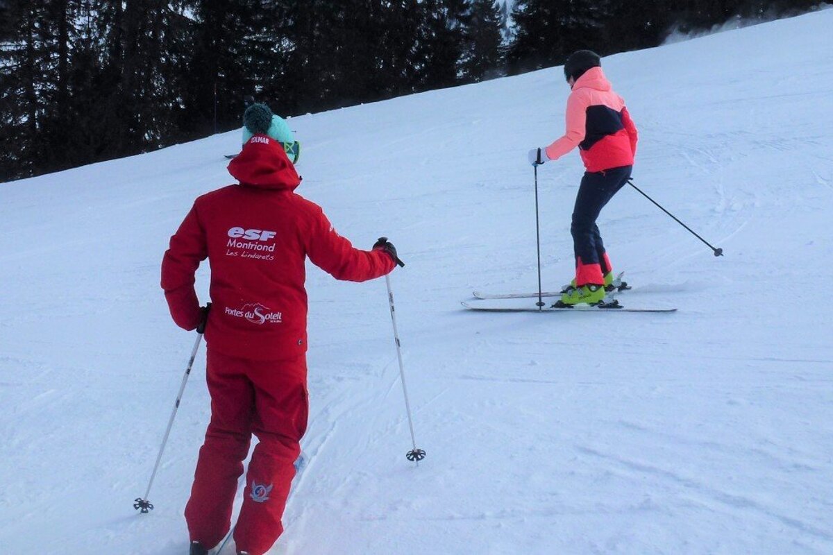 a ski instructor giving a private lesson