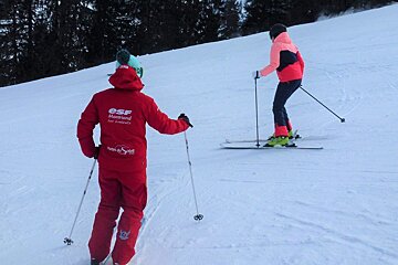 a ski instructor giving a private lesson
