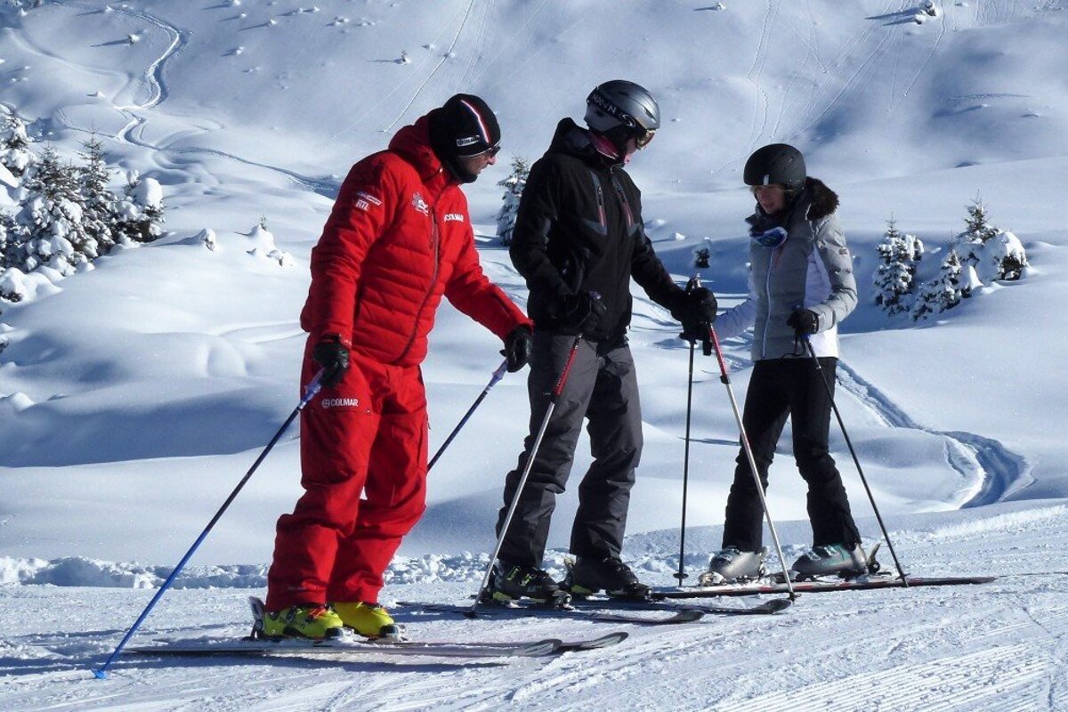 a ski instructor giving a private lesson