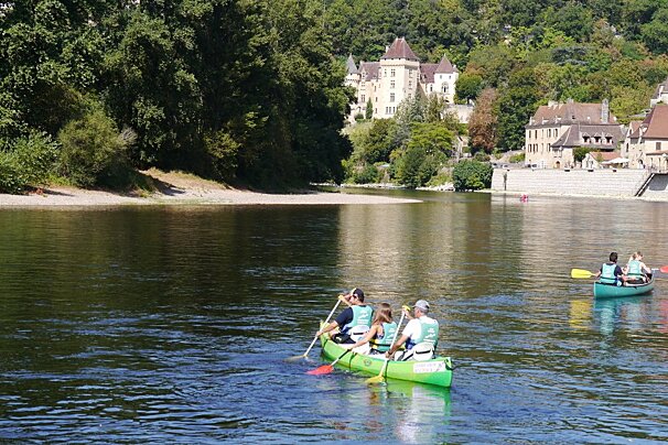 two canoes in the water at la roque gageac