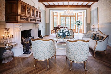 A living room filled with furniture and a fireplace
