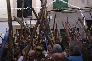 lots of people play fighting in the streets of mallorca