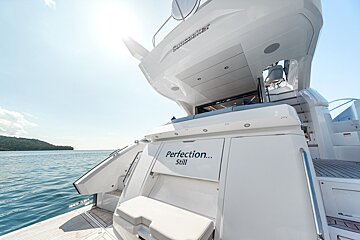The back of a white yacht says perfection still