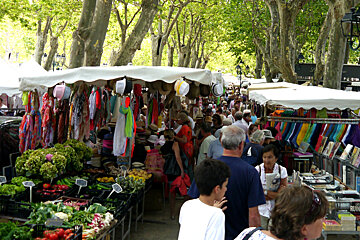 image of stalls and people at a market