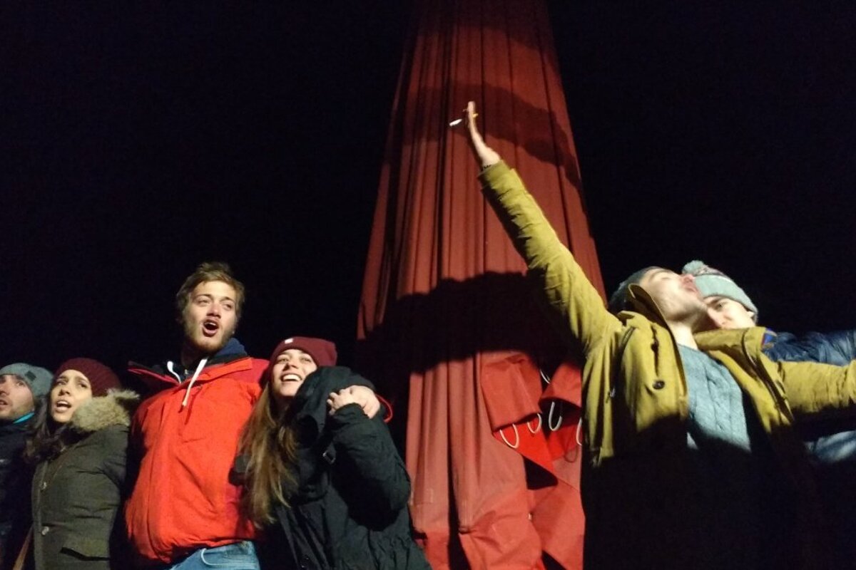 people dancing on a bar