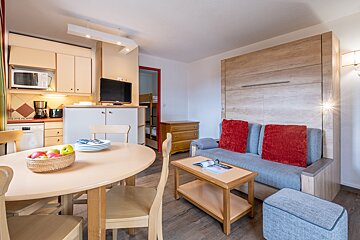 A living room with a couch and a table