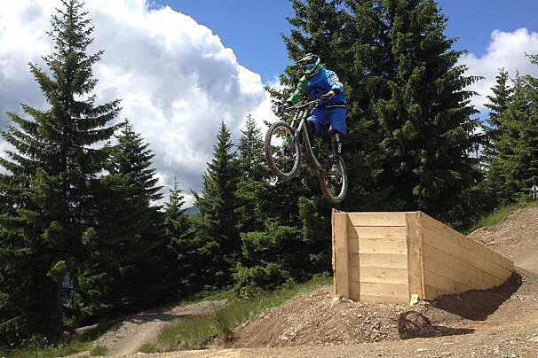 a biker jumping a gap