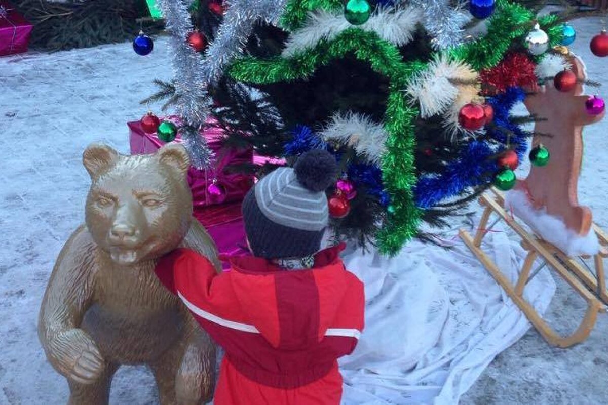 a child playing with a bear