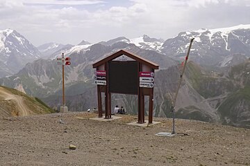 two people sat having lunch on the side of the mountain 