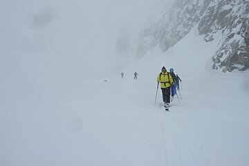 skiers in the mist