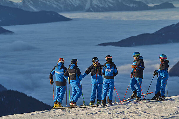 a group of ski and snowboard instructors