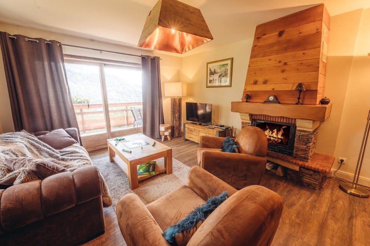 A living room with a fireplace and a couch