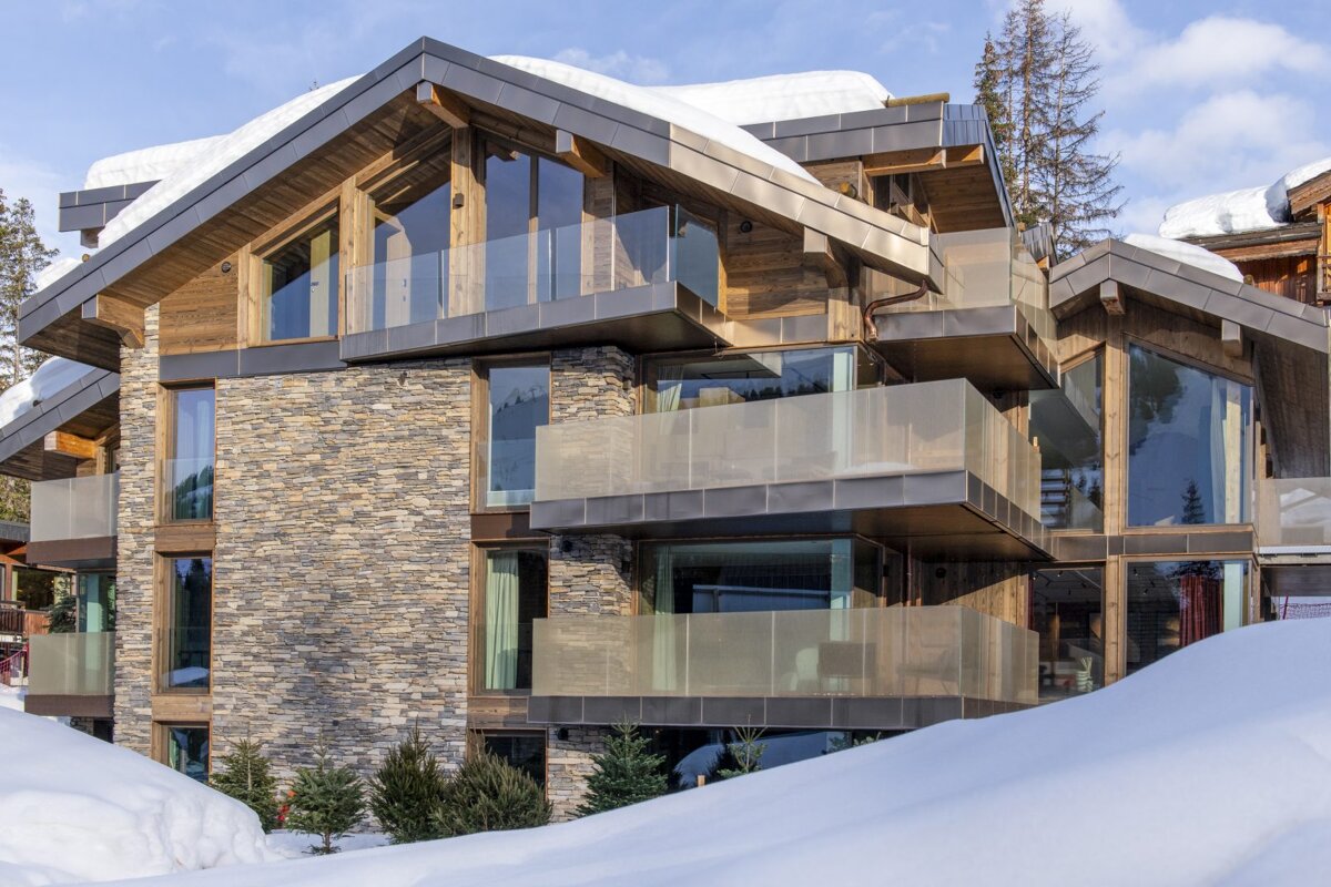 A large house with a lot of windows and balconies