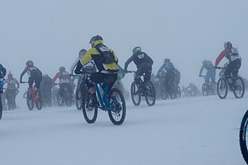 mountain bikers on a race on the glacier
