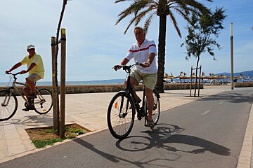 a photo of two cyclists in cuitat jardin majorca