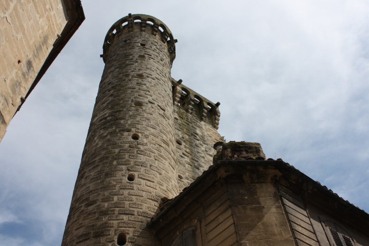 a round tower and a medieval building in provence