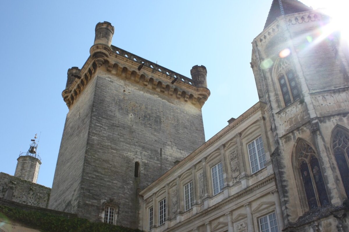 a grand looking stone building in uzes, provence