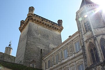 a grand looking stone building in uzes, provence