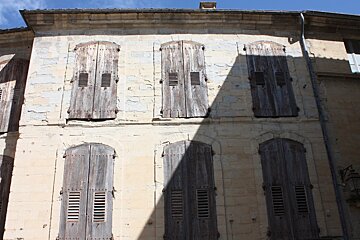a shuttered building in Uzes provence