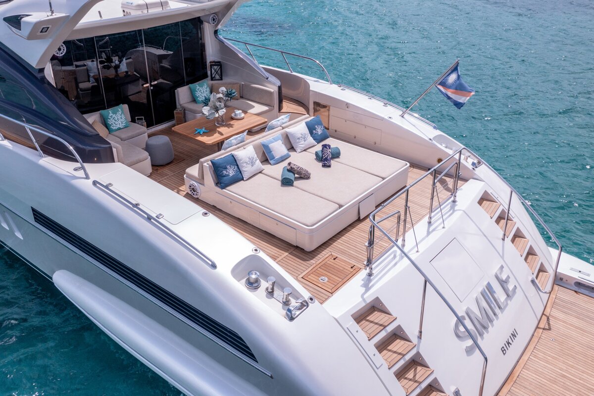 A yacht with the name smile on the back of it