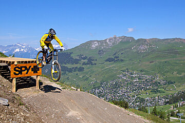 a mountain biker about to land a jump