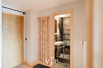 A bathroom with a wooden door and a sign that says vip