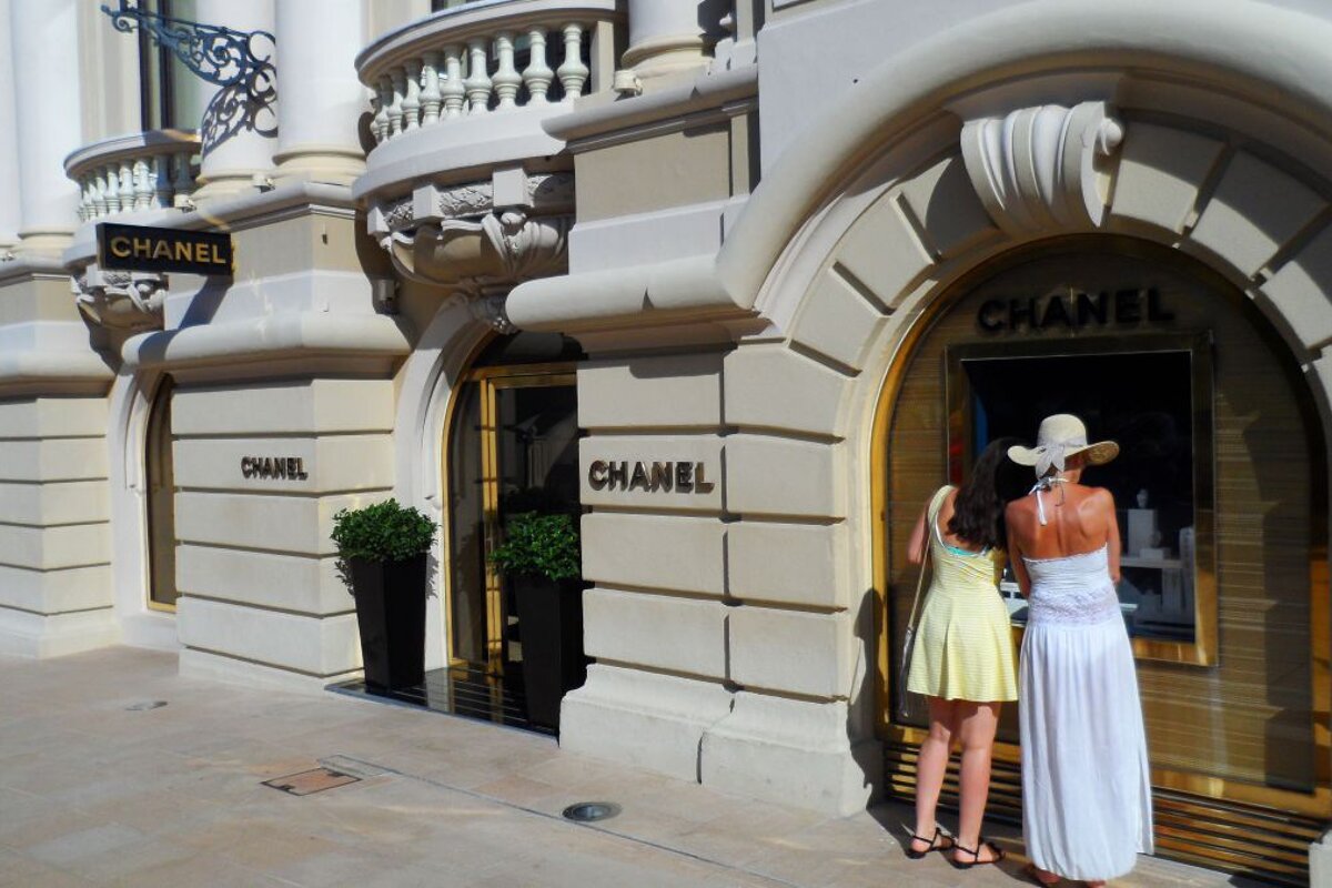exterior of chanel with people looking in the window