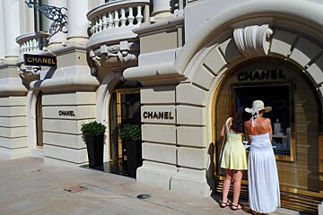 exterior of chanel with people looking in the window