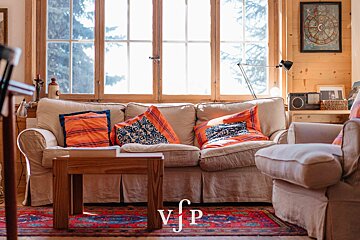 A living room with a couch and chairs and a sign that says vip