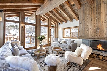 A living room filled with furniture and a fireplace