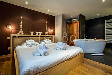 A bedroom with a bathtub and a sign that says holidays