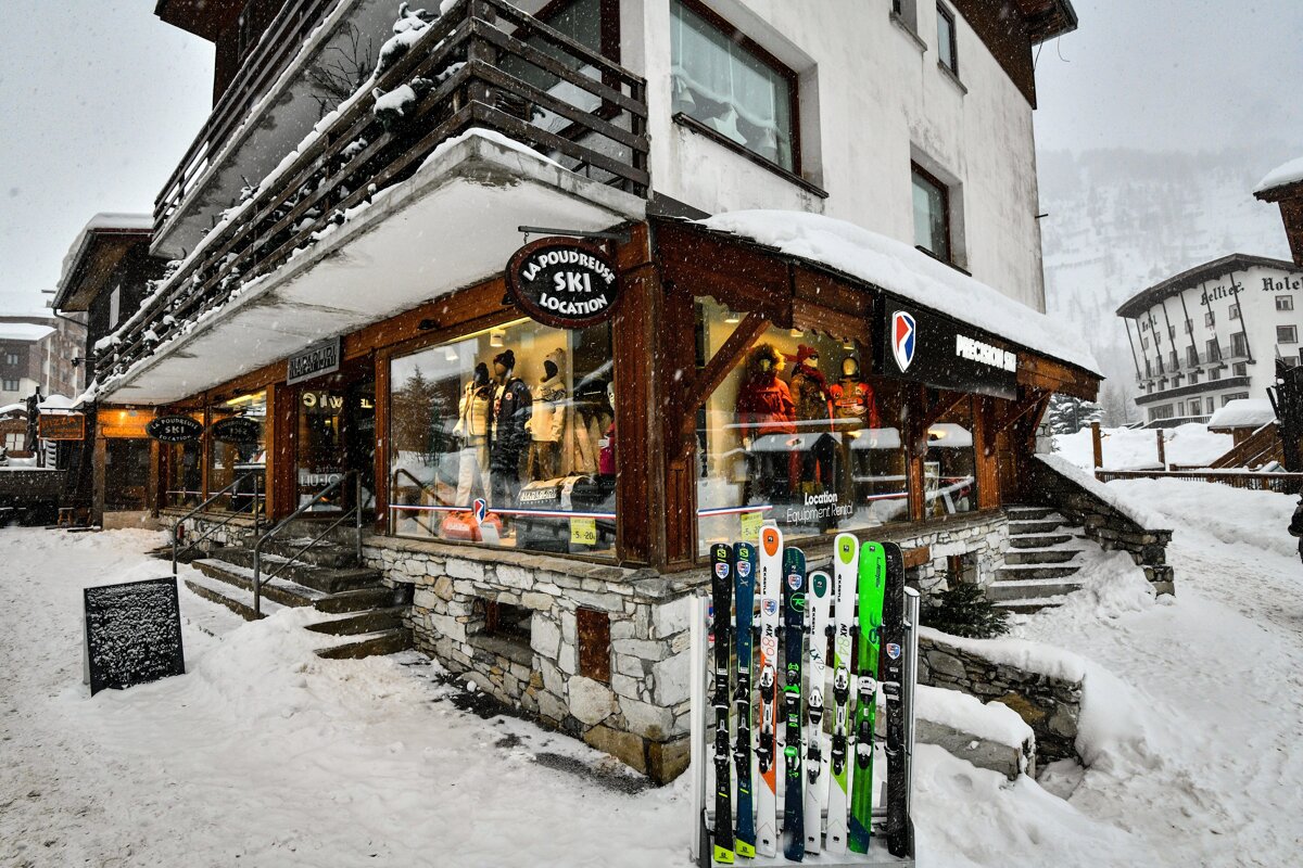 A snow-covered ski rental shop (
