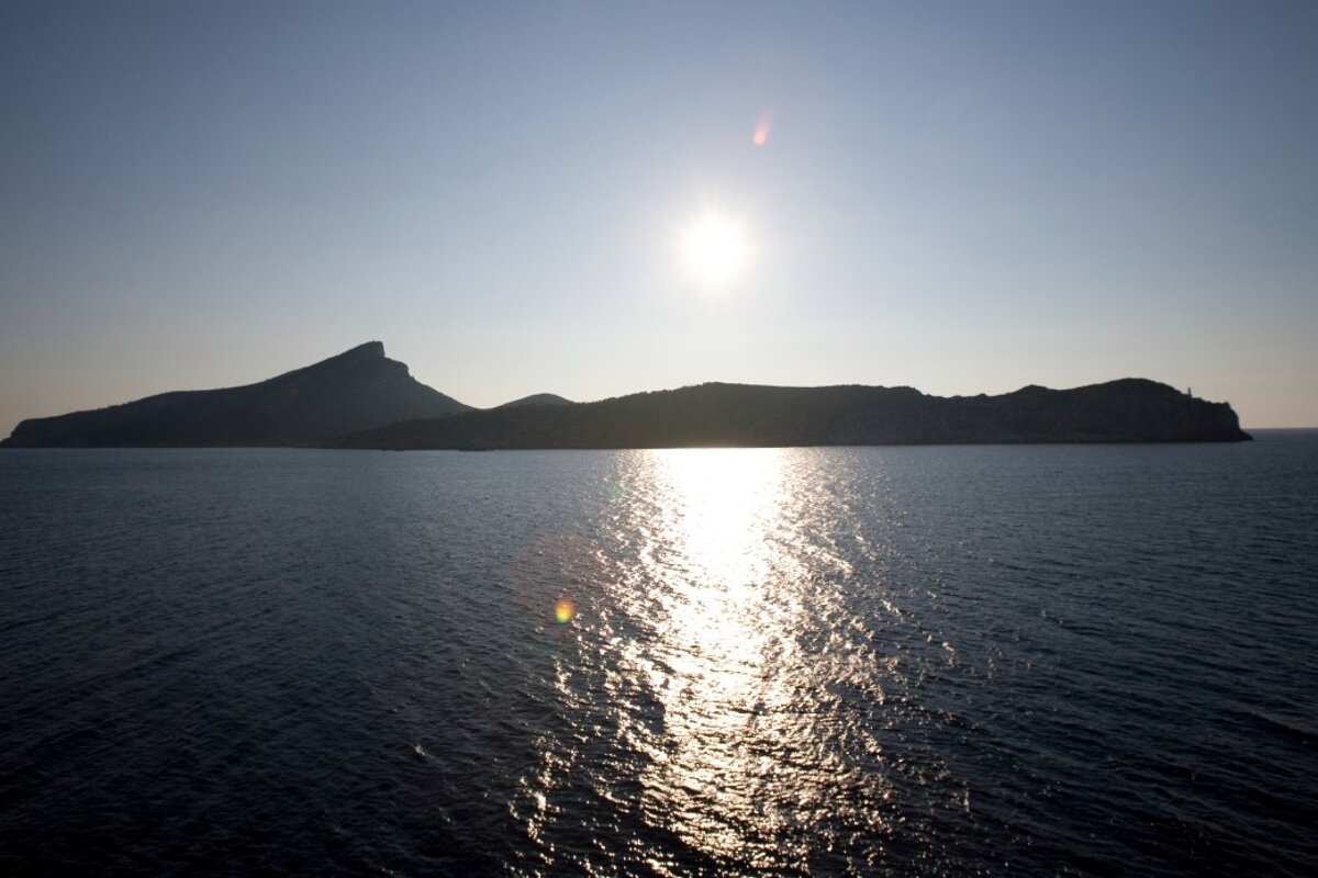 view of the whole island with the sun over it