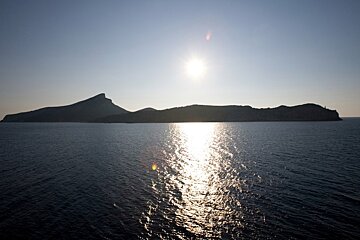 view of the whole island with the sun over it
