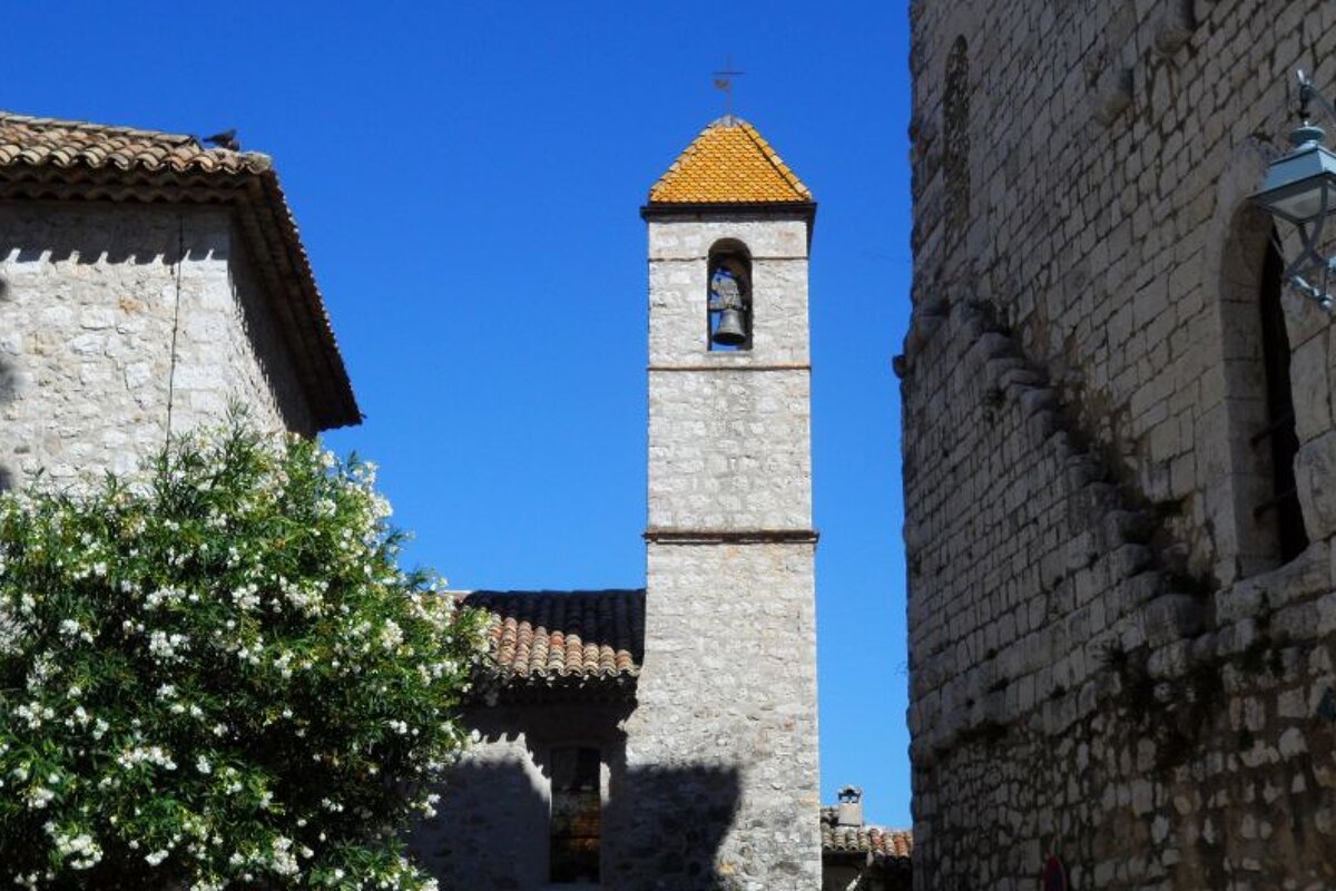 a bell tower with a tiled roof