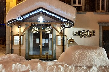 A restaurant called lamyze is covered in snow
