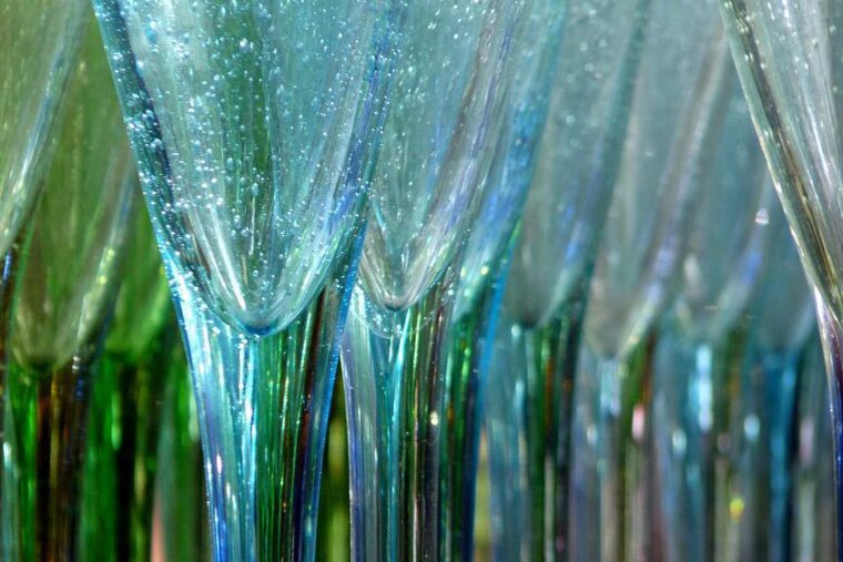a group of wine glasses in Biot glassware style