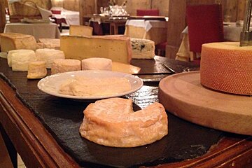 cheeses on display at a restaurant in Morzine