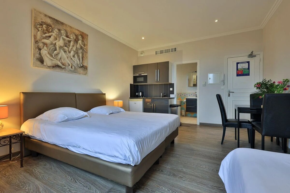 A hotel room with a sign on the door that says ' emergency exit '