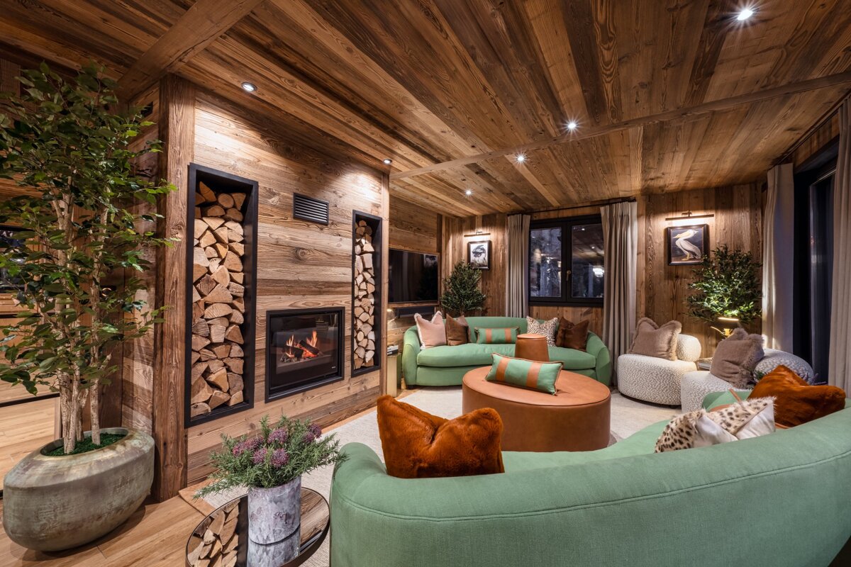 A living room filled with furniture and a fireplace