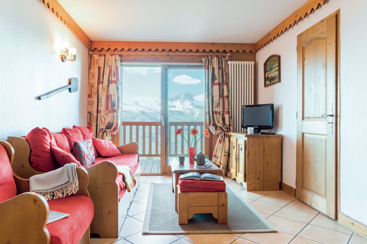 A living room with a couch and a television