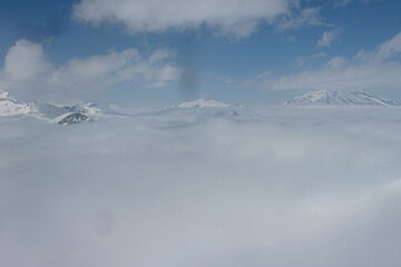 clouds hovering over the valley