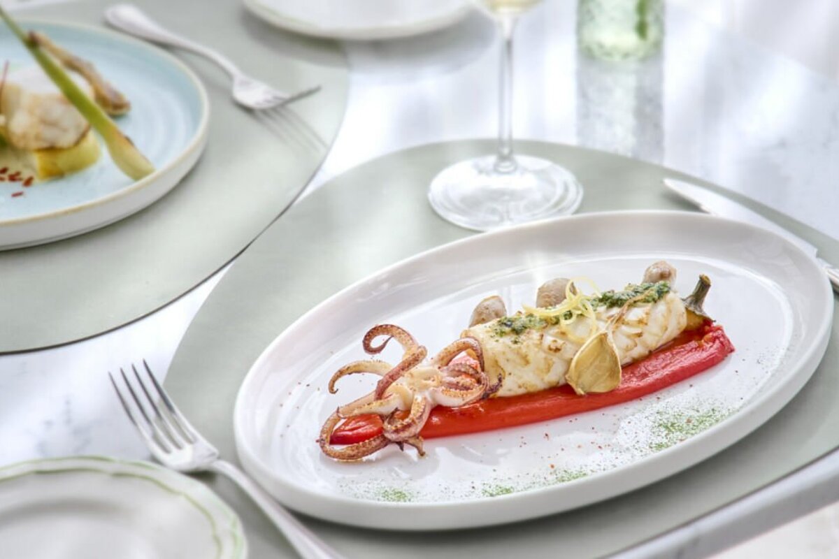 A plate of food with a squid on it