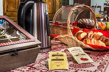Two bags of twinings earl grey tea sit on a table