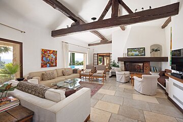 A living room filled with furniture and a fireplace