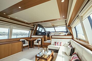 A living room on a boat with a couch and table