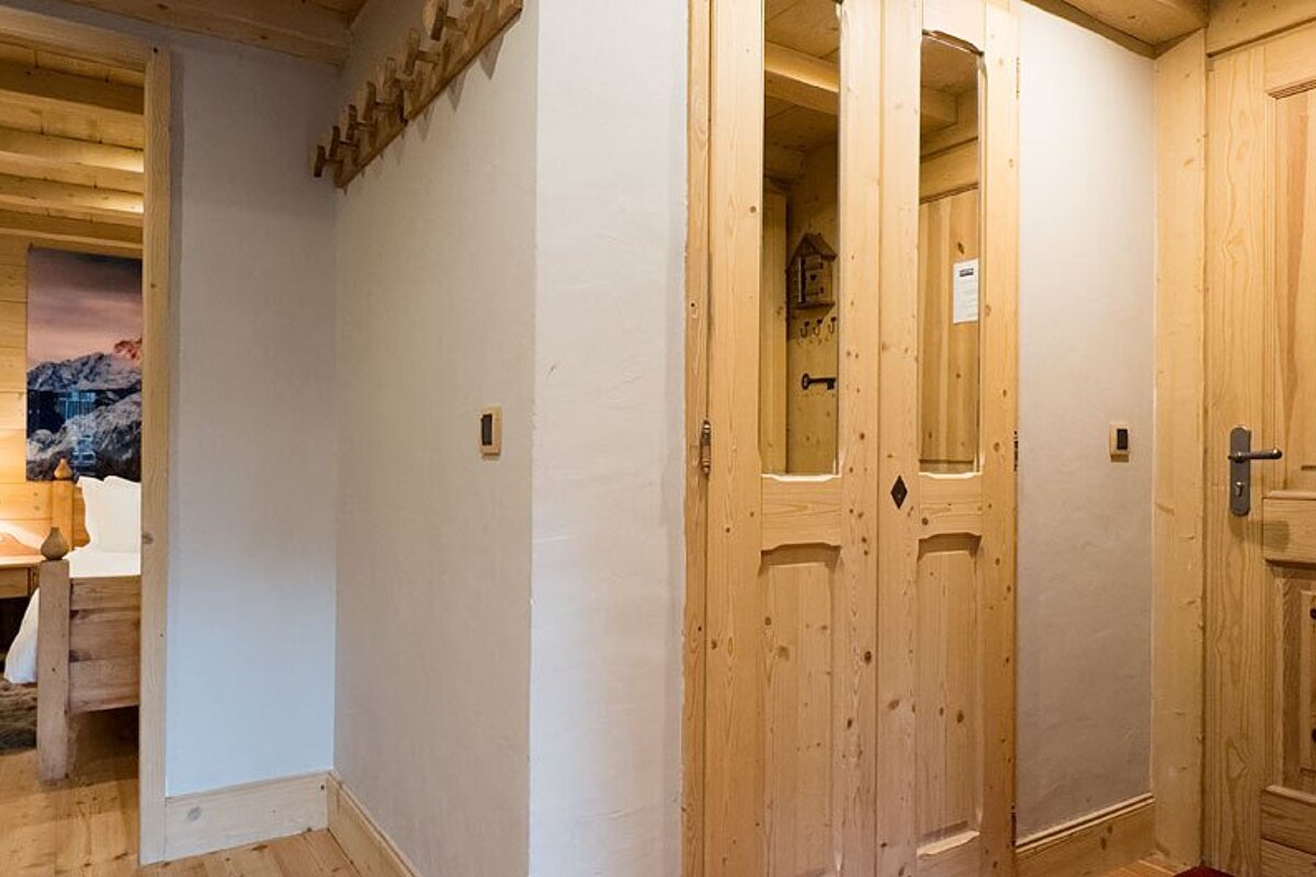 A wooden door with a sticker on it that says ' a ' on it