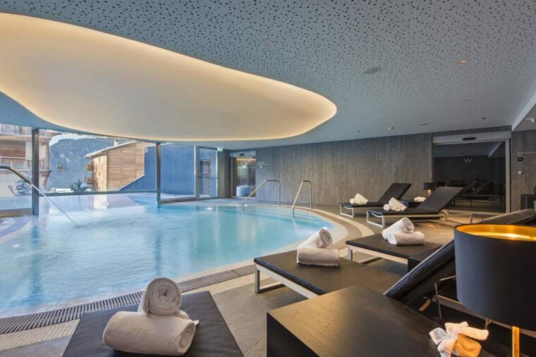 an in door pool and relaxation area