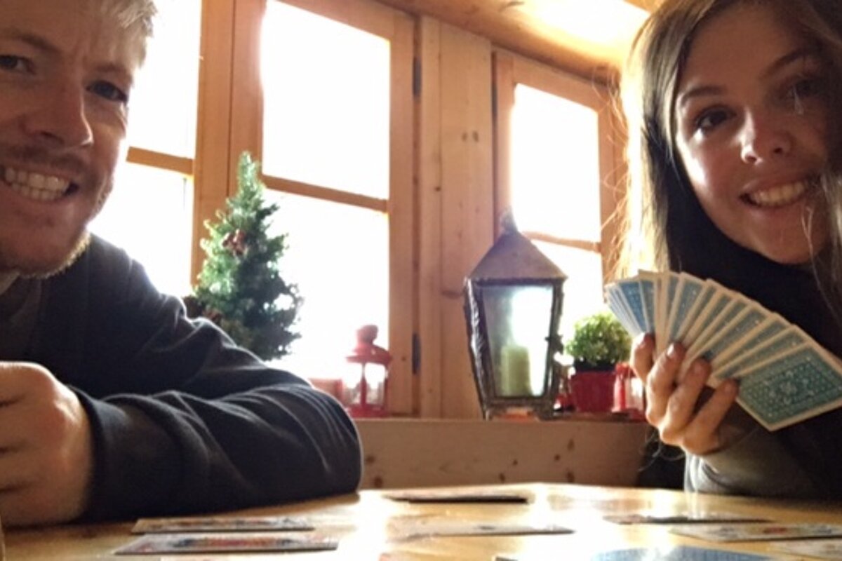a couple playing cards in a restaurant